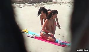 Topless brunettes blows and fucks on the beach!